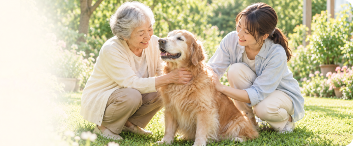 庭で愛犬と穏やかな時間を過ごすご家族